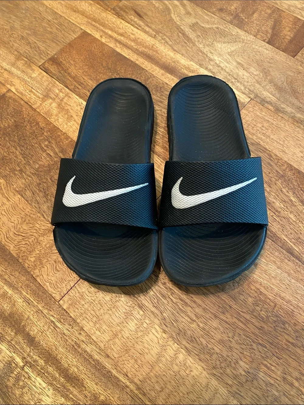 Nike Black Slides with White Swoosh Logo